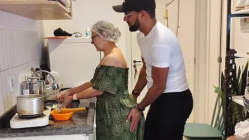 Eighty-five year old grandma bent over the kitchen counter taking her perverted grandson's cock