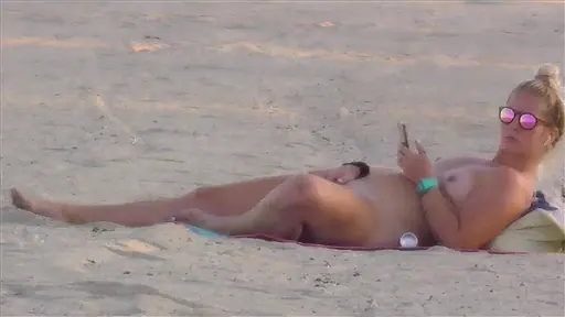 Caught my own sister spreading her legs on a public beach and rubbing her pussy in broad daylight
